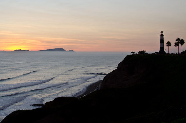 Sunset view of the lighthouse off the coast of Miraflores, Lima, Peru.