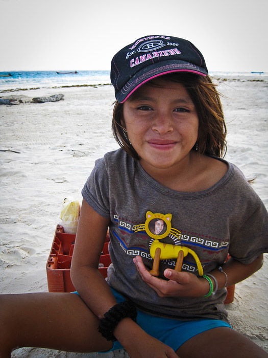 Little girl on the beach in Tulum